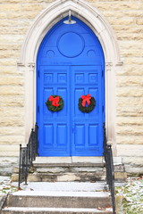 Fototapeta na wymiar Blue Church Doors and Wreaths