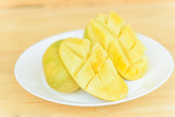  Ripe mango in the white dish
