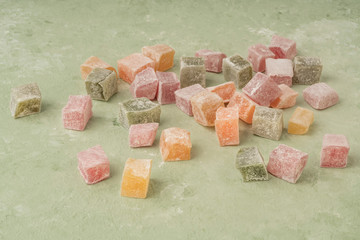 colorful assortment of Turkish delights on green background