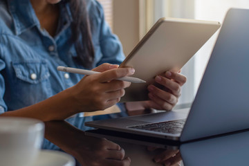 Young female hipster use tablet computer.