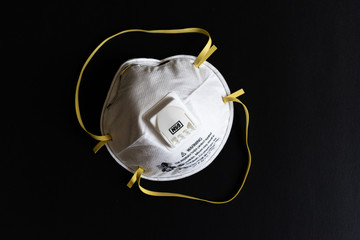 Protective masks on black background. N95 mask on the black background.  Medical and construction PPE. Respirator mask.