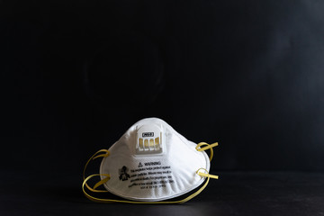 Protective masks on black background. N95 masks on a black background. Medical and construction protective equipment. N95 masks M3