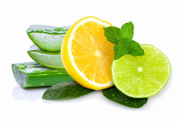 Fresh yellow and green lemon lime fruit with mint leaf and aloe vera slice isolated on white...