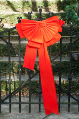 red bow fence gift 