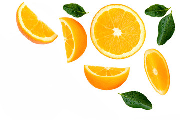 Closeup slice of ripe fresh orange fruit with green leaf isolated on white background. Top view. Flat lay.