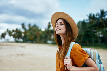 young woman in hat on the beach