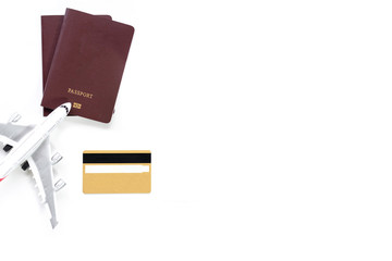 Mock up image of golden credit card , mobile smart phone with blank white screen, passport and airplane model isolated on white background. Business technology trip and travel concept. Top view. Flat.
