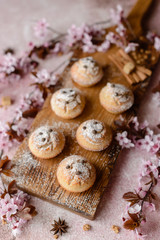 Fresh baked cupcakes of rice flour with banana and vanilla with a mug of hot chocolate