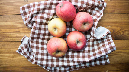 ripe apples on a wooden background
