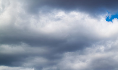 Fototapeta premium stormy grey and white clouds on blue sky background