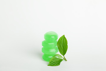 Cough lozenges with mint green leaves