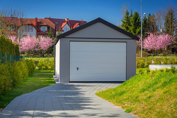 Free-standing garage in the sunny garden