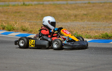 Young go cart racer on circuit