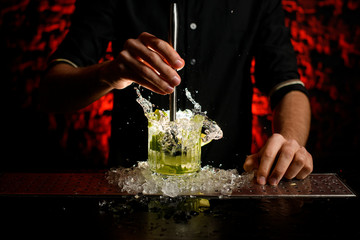 close-up barman accurate mix cocktail using metal madler