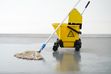 Mop and bucket, janitorial service.