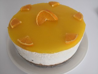 A detail of An orange cheesecake