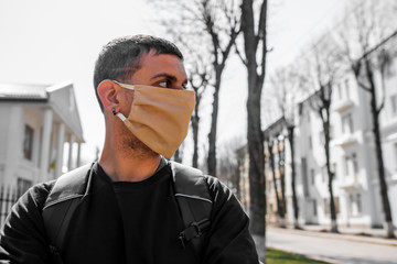 Masked guy on the street in a black sweater