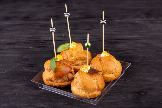 Canape with a pate of chicken, beef and duck, served in ecklers with greens
