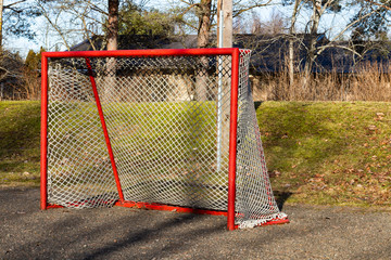 Red road hockey net on children playground in Finland