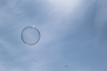 soap bubbles on blue sky