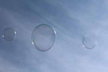 soap bubbles on blue sky