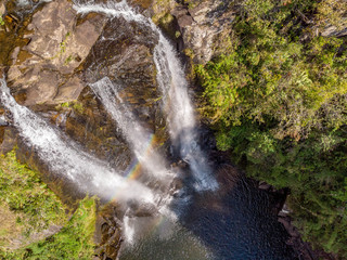 rainbow waterfall in the mountains