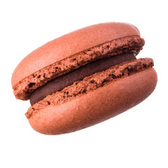 Macro photo of french caramel macaroon or macaron isolated on white background