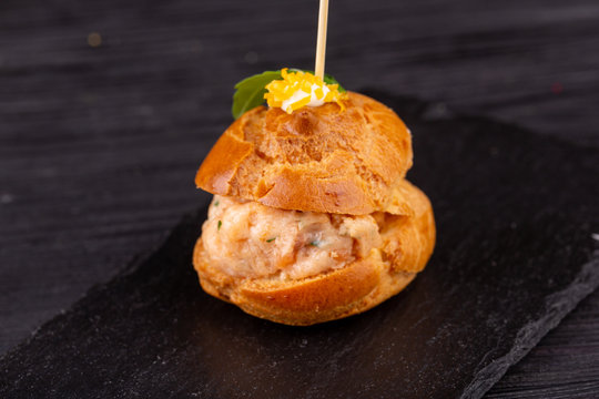 Canape with a pate of chicken, beef and duck, served in ecklers with greens
