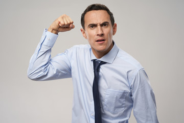 young businessman with hands up