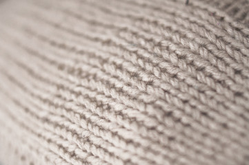 .knitted pillows handmade at home in bed .needles ,purl and facial knitting,soft and warm material