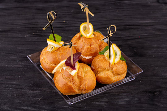 Canape with a pate of chicken, beef and duck, served in ecklers with greens
