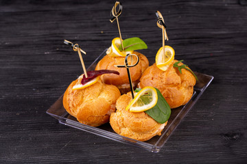 Canape with a pate of chicken, beef and duck, served in ecklers with greens
