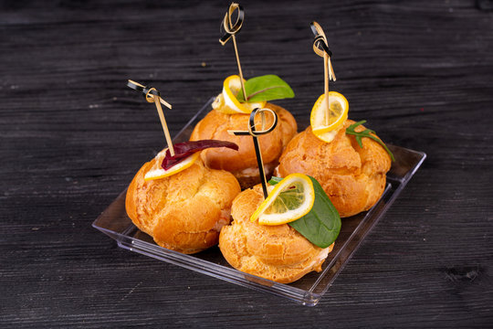 Canape with a pate of chicken, beef and duck, served in ecklers with greens
