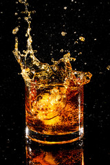 splash glass of whiskey ices