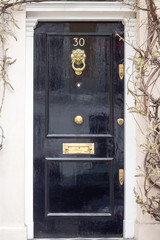Stately front door in London with the number 30