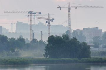 operating cranes restore the city after the disaster