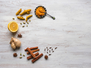Food background with turmeric, cinnamon,ginger, lemon and pepper. Prevention of antiviral infections. Copy space
