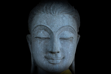 Fototapeta na wymiar Mystical Buddha statue's face, face of ancient stone Buddha statue