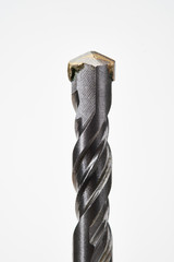 Detail of SDS drill bit on white background.