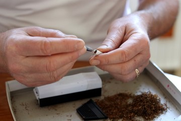 making cigarettes close-up tobacco