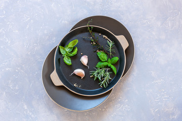 Spicy herbs, seasonings and spices. Close-up, top view on a light gray background