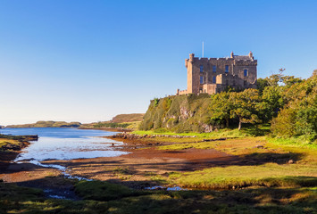 Fototapeta premium Dunvegan, Scotland / United Kingdom - August 25, 2014: The Dunvegan Castle on the shore of Loch Dunvegan