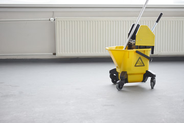 Mop and bucket, janitorial service.