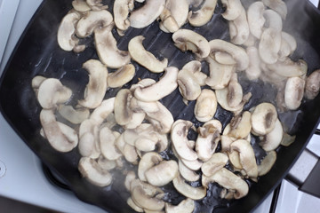 Frying champignon mushroom