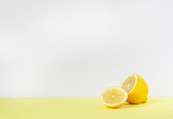 lemon in a cut on a yellow table