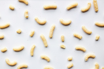 Sweet corn sticks scattered on white background unorganized close up front view