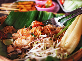 Thai food called Pad Thai. Fresh shrimp placed on banana leaves.