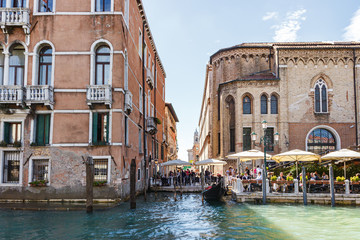 Naklejka premium Water channels of Venice city. Facades of residential buildings overlooking the Grand Canal in Venice, Italy.