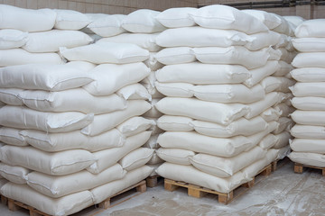 Sacks of flour on a pallet. Flour in the bags.