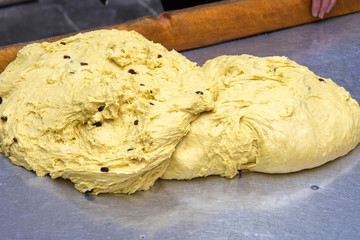 Dough with raisins for baking Easter cakes. Fresh pastry